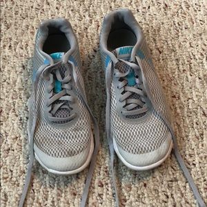 grey and blue nike running sneakers